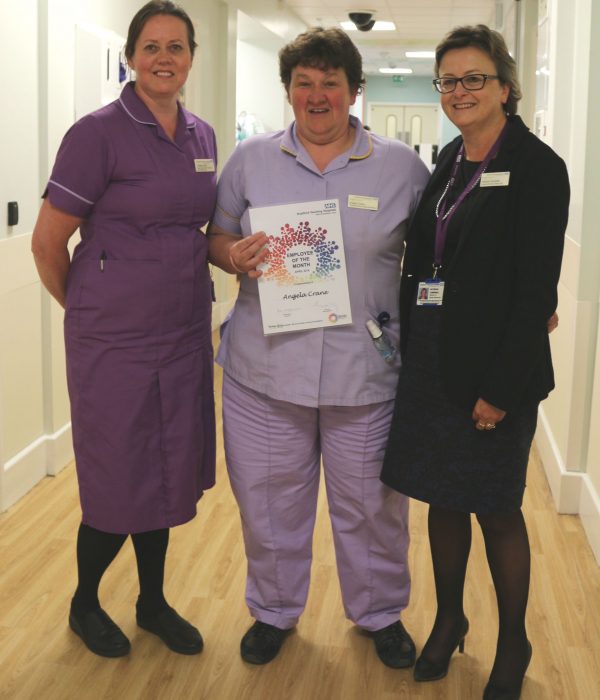 April 2018's Employee of the Month, Angela Crane (centre), with Senior Sister Collette Devlin, and Director of HR, Pat Campbell.