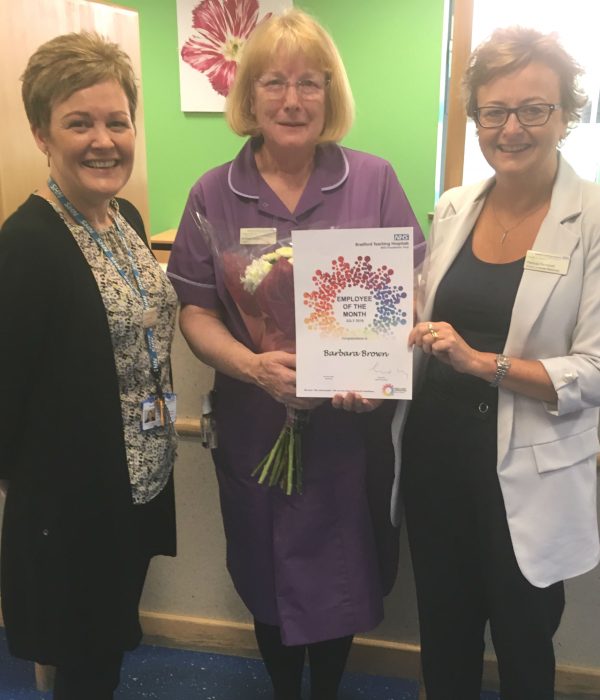 Sister Barbara Brown (centre) receives her award from Pat Campbell, head of HR (right), and Jo Young, head of planned access