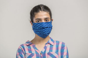 Portrait of a girl covered with homemade mask for prevention during covid-19 pandemic